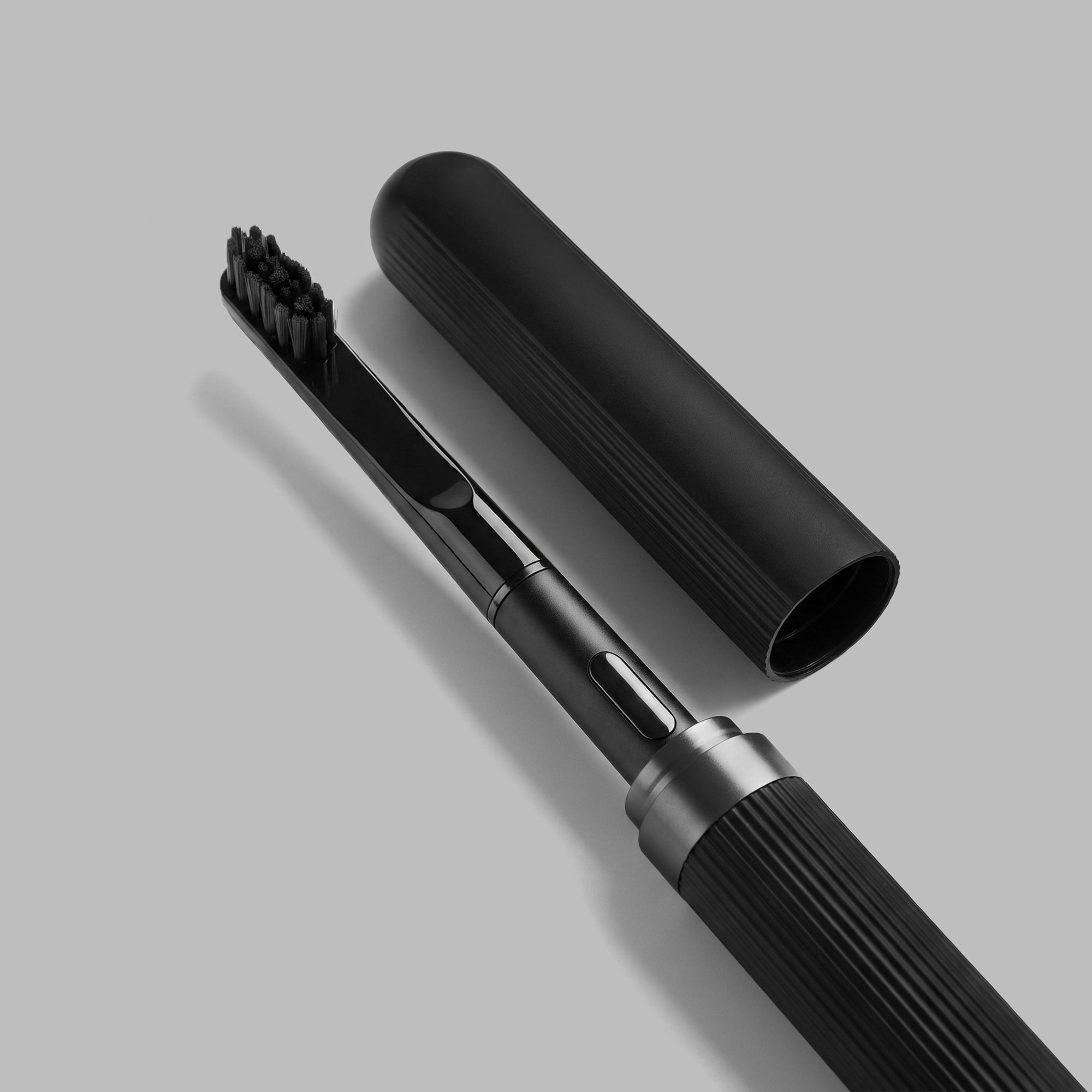 Slim matte-black aluminium sonic toothbrush, full length — BLACKVERSE
