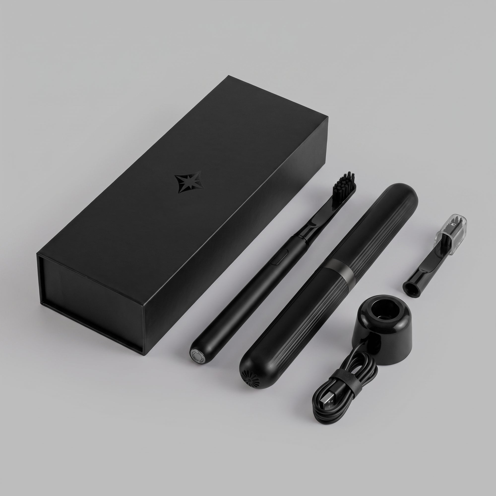 Black sonic toothbrush kit — handle, travel case, charging base, spare head and box — BLACKVERSE
