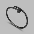 Black nail-shaped cuff bracelet with pavé detailing — BLACKVERSE