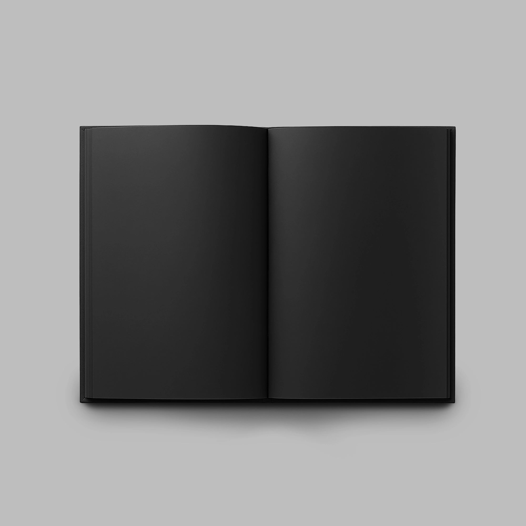 all-black notebook open on black pages with bookmark – Blackverse