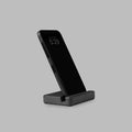 Black concrete phone holder, detail of the star logo — BLACKVERSE