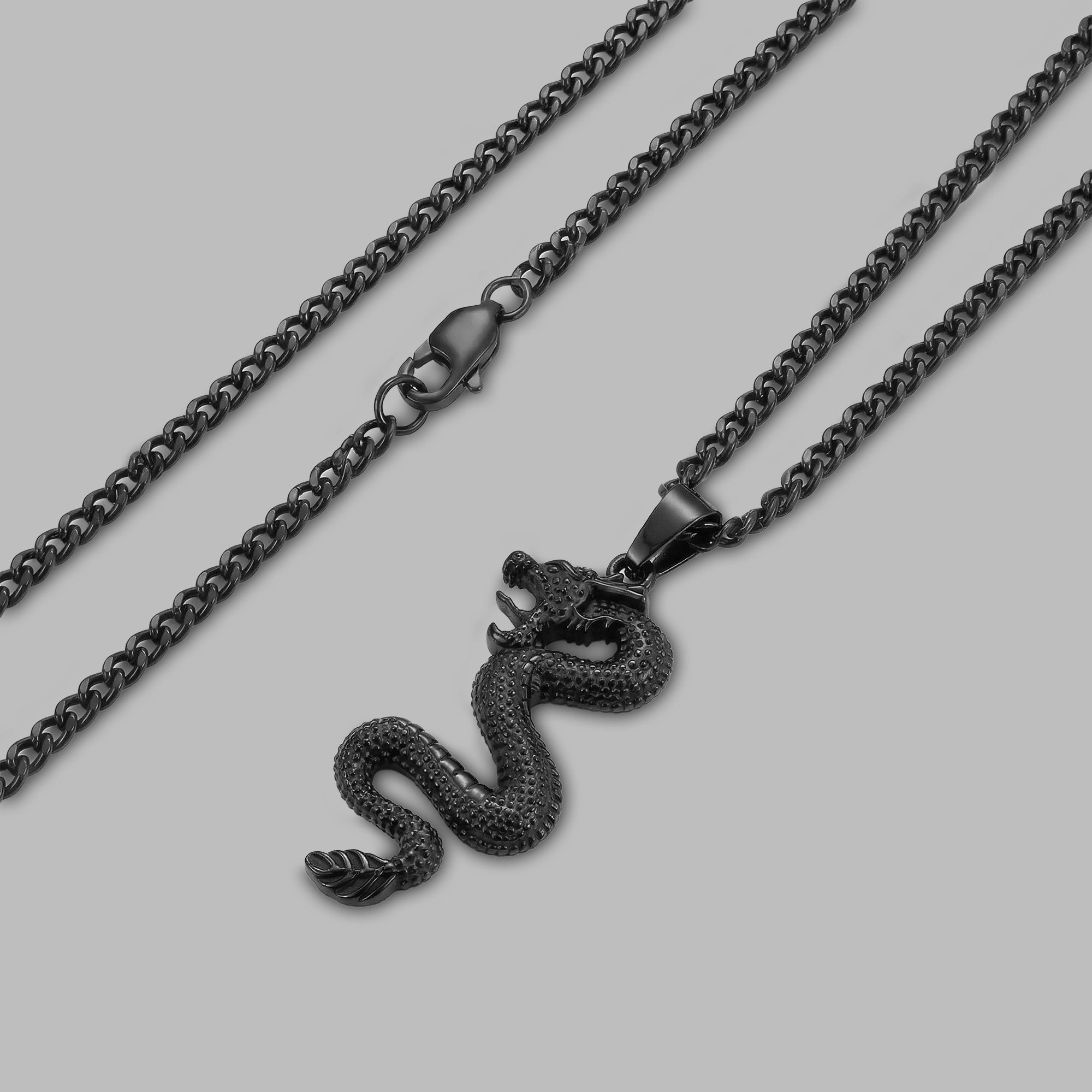 Black dragon pendant, angled view — BLACKVERSE