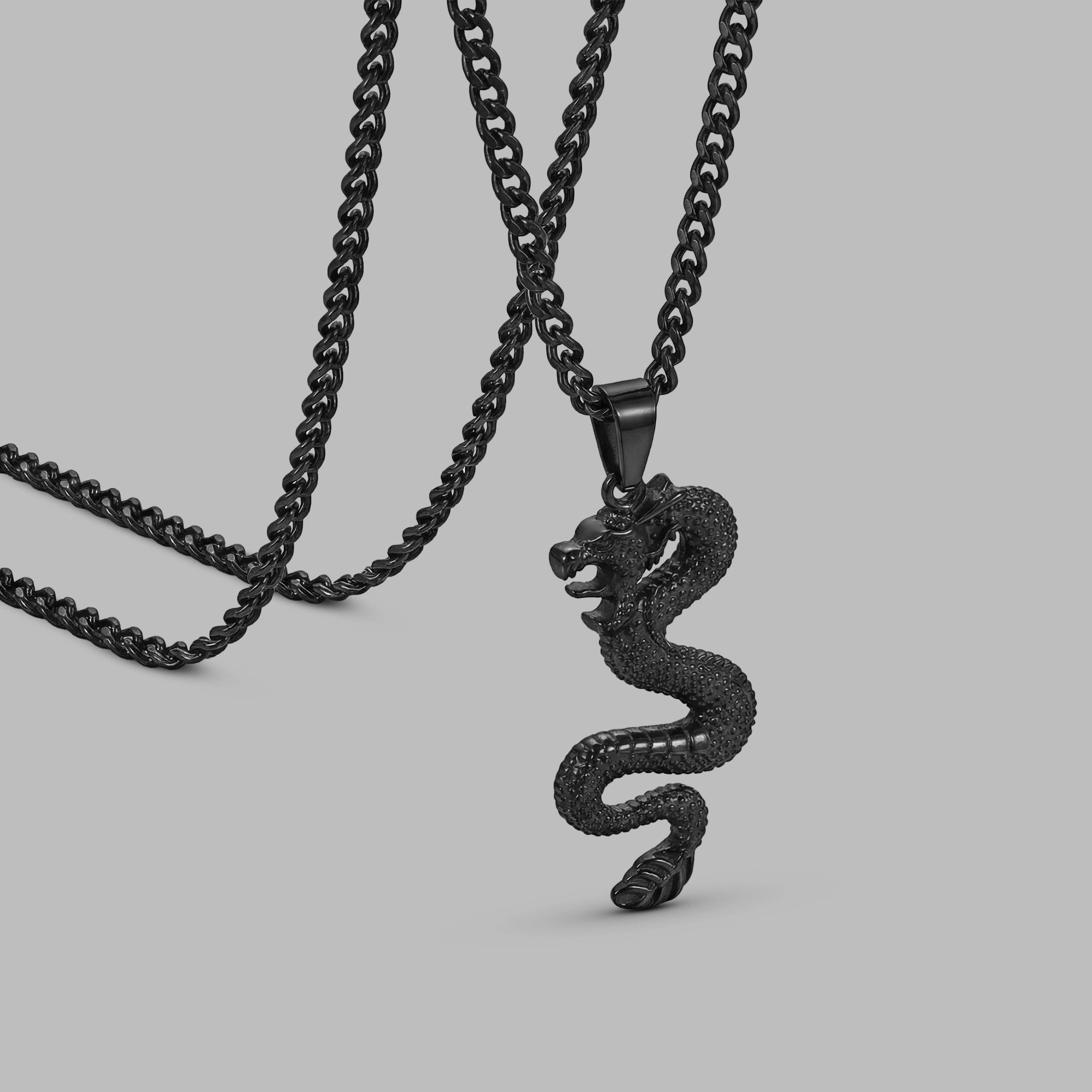 Black dragon pendant, detail of the coiled form — BLACKVERSE