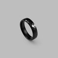 Glossy black ceramic ring with a faceted band — BLACKVERSE