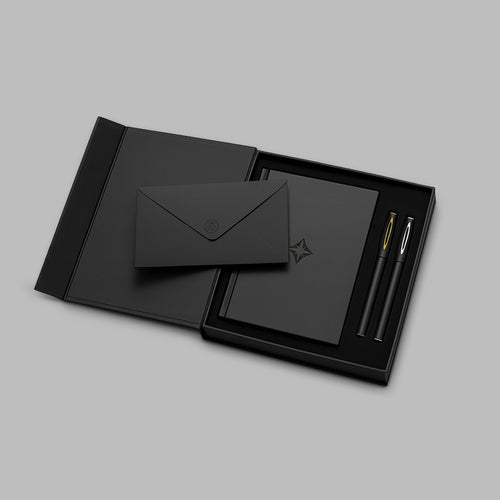 Black gift box set with the notebook, a black envelope, and two gel pens — BLACKVERSE